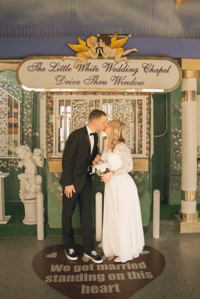 Hillary & Ryan 10.18.25 2 Couple kissing at the Little White Chapel Drive Thru Wedding