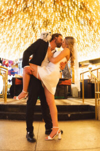 Vegas Elopement Couple kissing under neon lights