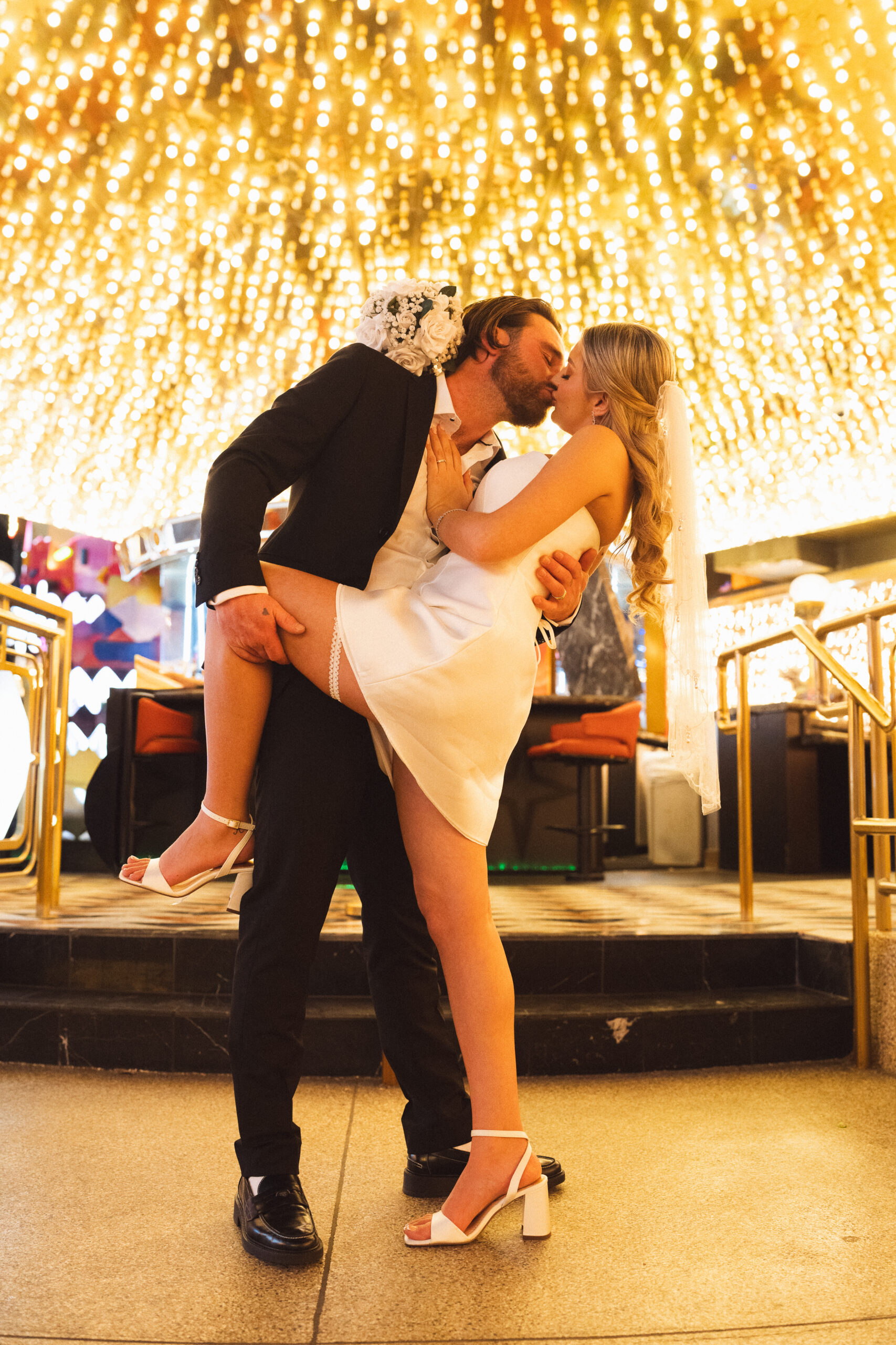 Vegas Elopement Couple kissing under neon lights